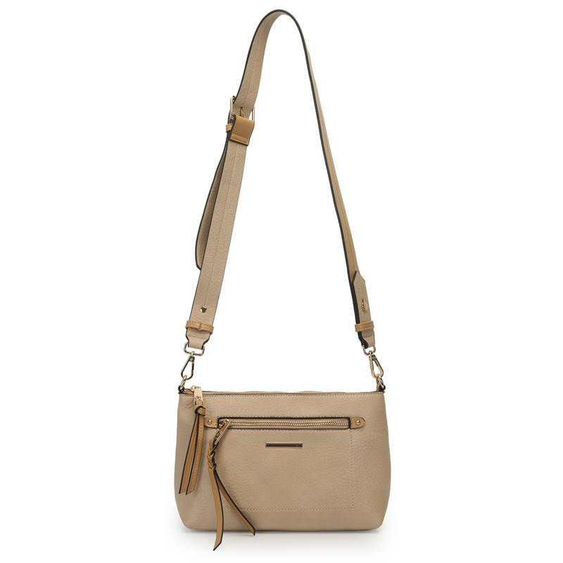 Bolsa WJ bege mostrando alça ajustável, ferragens douradas e bolso frontal com tassel
